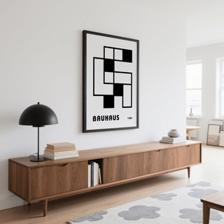 Minimalist Block Art framed print with black and white blocks above a wooden sideboard with a black lamp