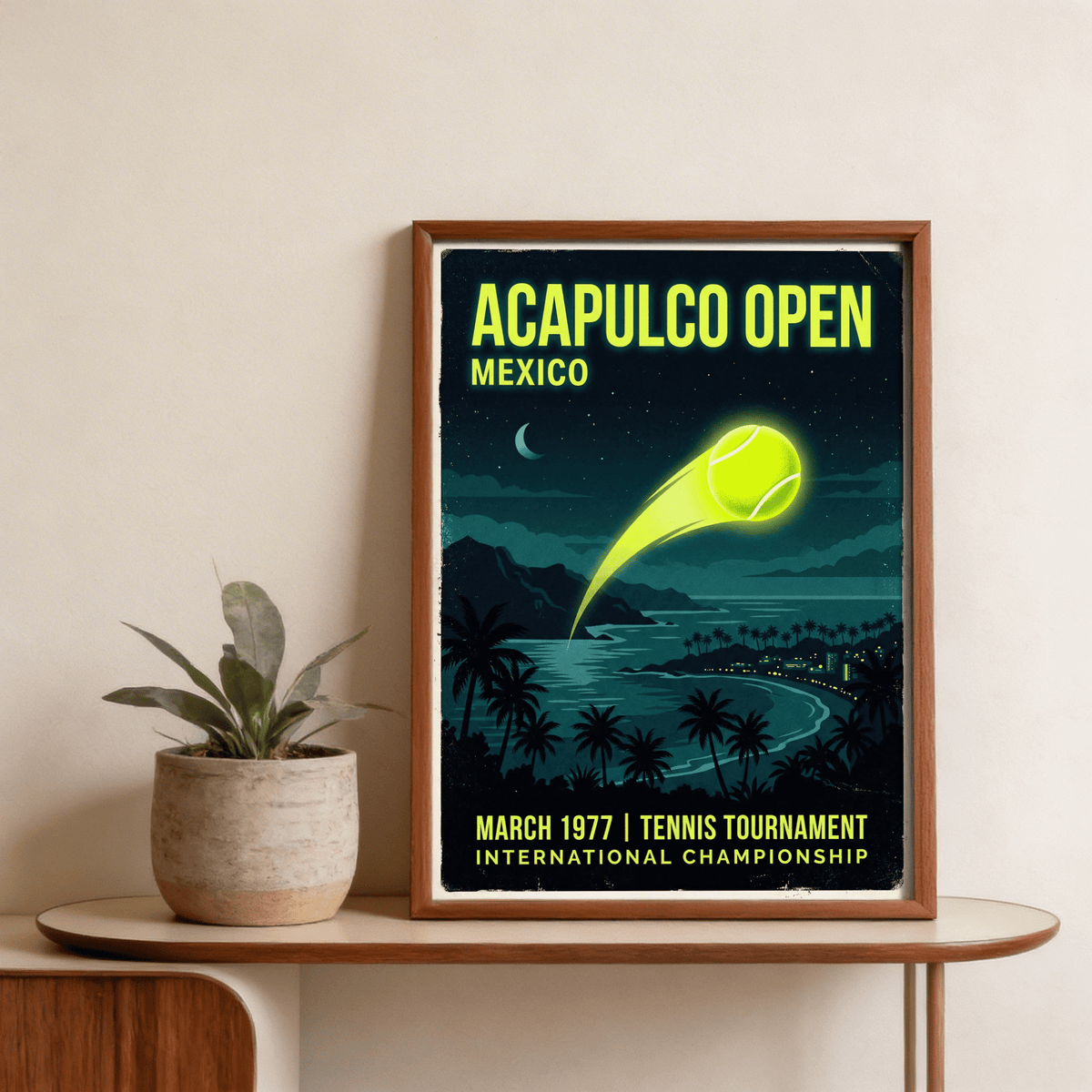 Framed Acapulco Open Tennis Art Print with retro illustration of tennis ball and night beach scene on shelf with plant