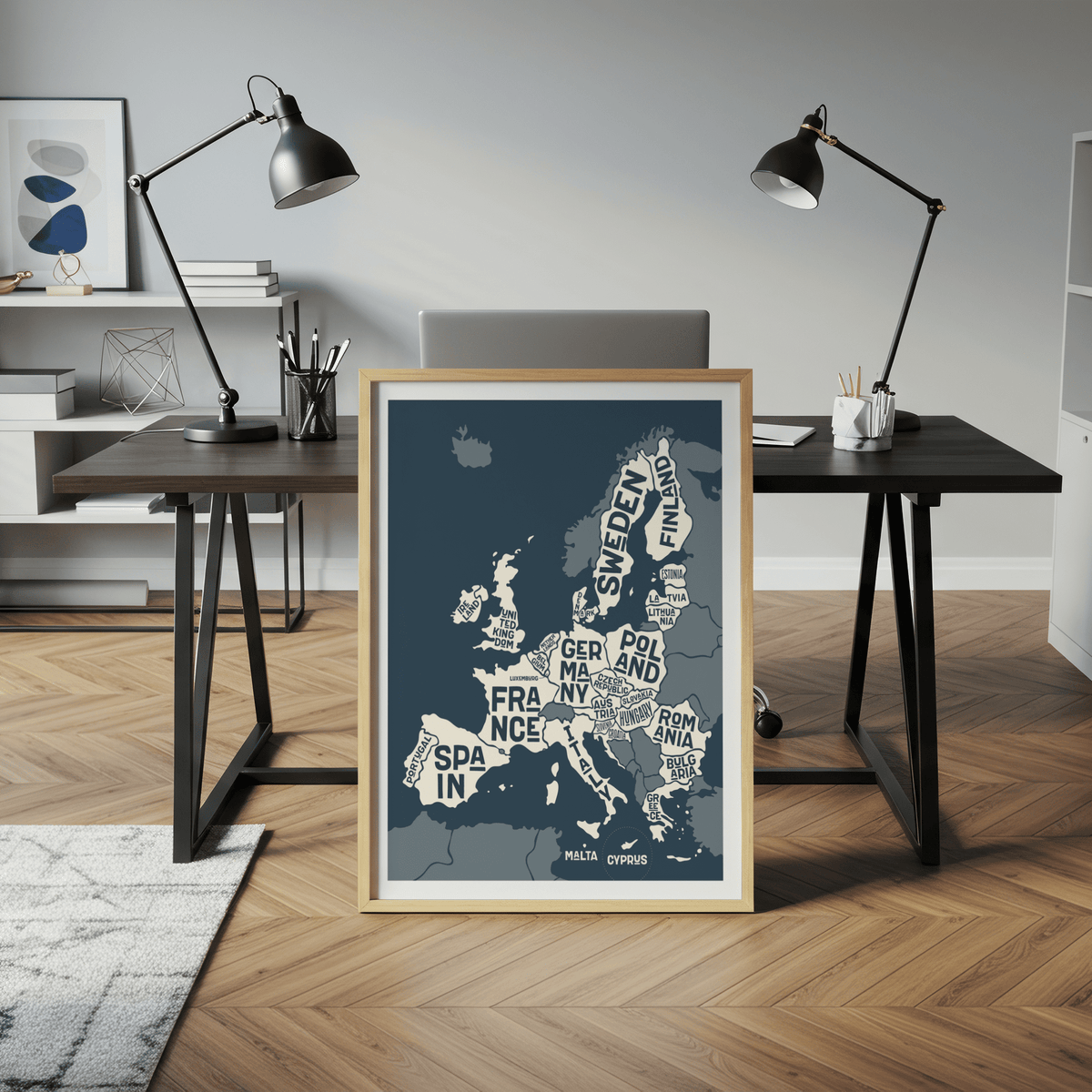 Print leaning on a floor in a modern office showing a typographic minimalist Europe map in blue and white colours