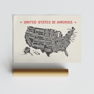 Rolled US Map Poster with minimalist typographic style and black and red colours next to a packaging tube