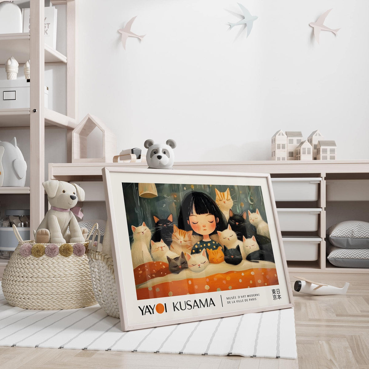 Cat art print leaning on a floor with a teddy bear head and children's room toys
