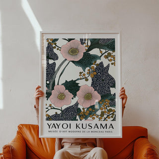 Pink wall art for bedroom held in hands showing pink flowers with dotted dark leaves and berries