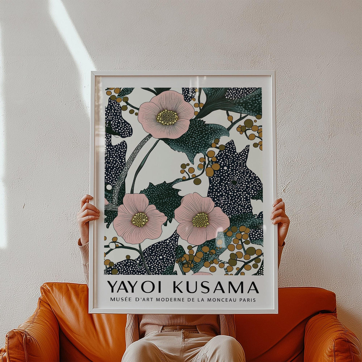 Pink wall art for bedroom held in hands showing pink flowers with dotted dark leaves and berries