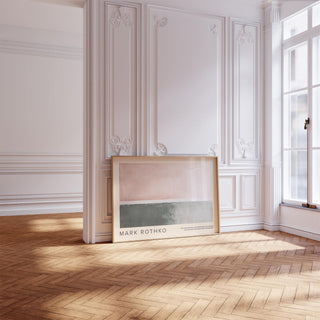 Horizontal wall decor of abstract blocks in muted pink and grey leaning on a parquet floor near a large window