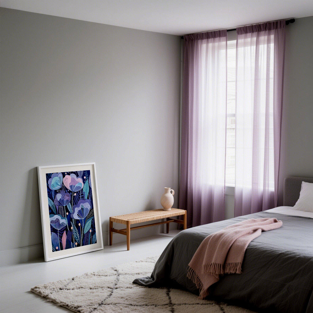 Purple flower poster leaning on a wall by a wooden bench and cream vase in a bedroom with lilac curtains