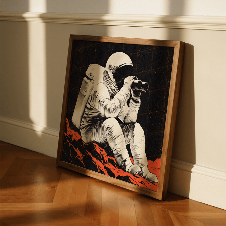 Print leaning on floor of an astronaut with binoculars on red rock in retro style
