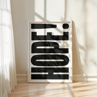 Motivational Work Posters print of large black HOPE typography leaning on floor by a wall with shadows