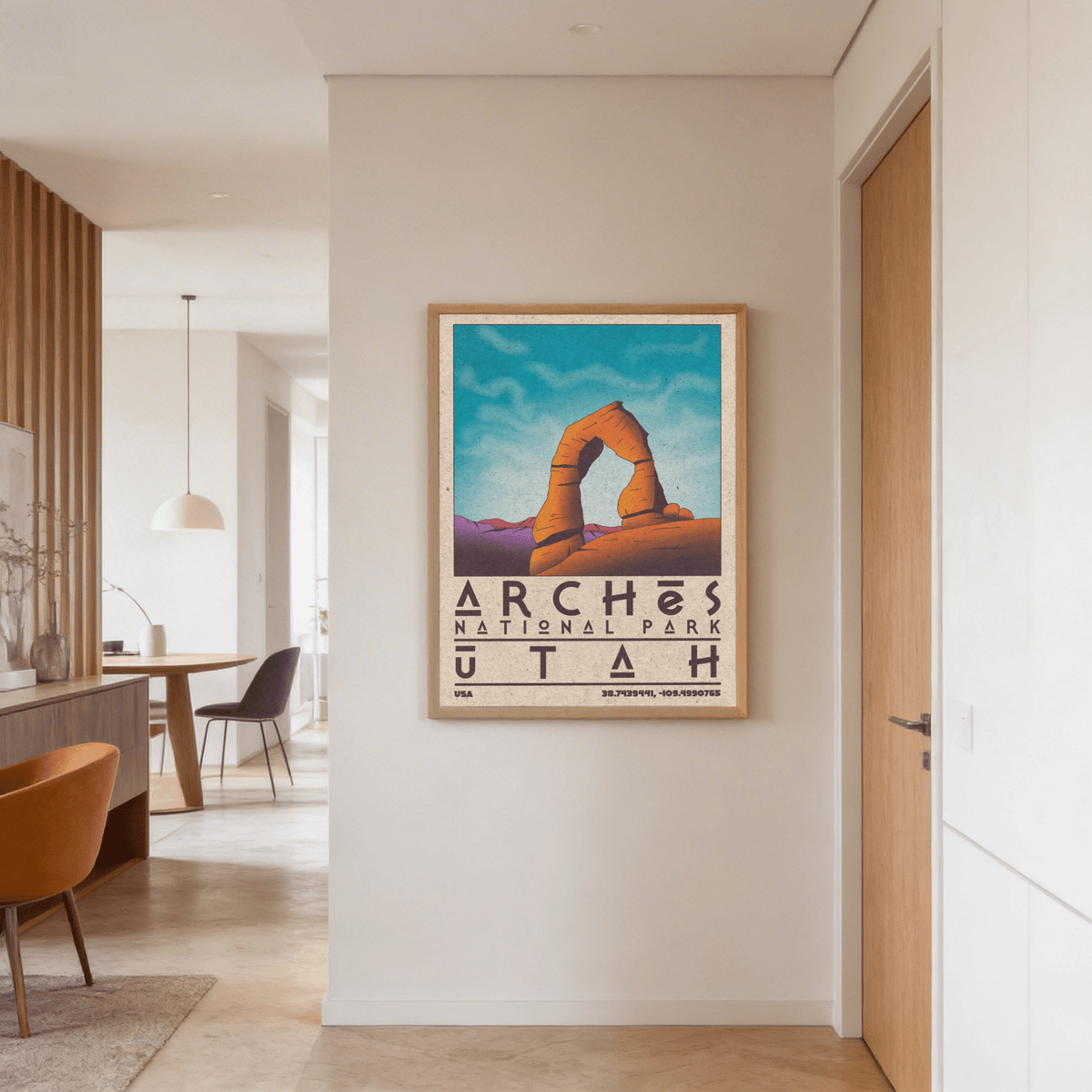 Utah wall art illustration of Delicate Arch in orange and purple hanging in a hallway near a wooden door