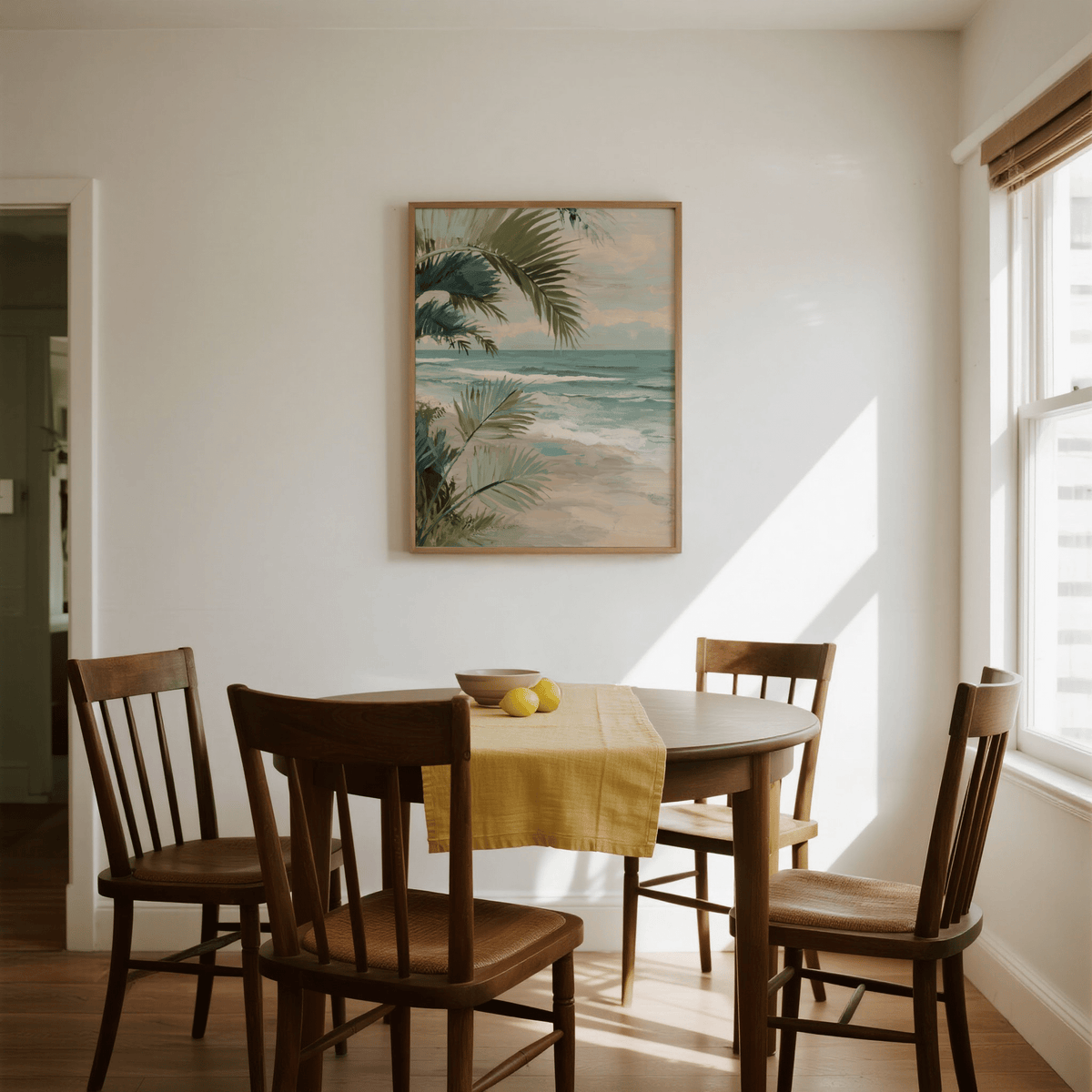 Tropical Beach Art print with palm leaves and sea in watercolour style above a round dining table with wooden chairs