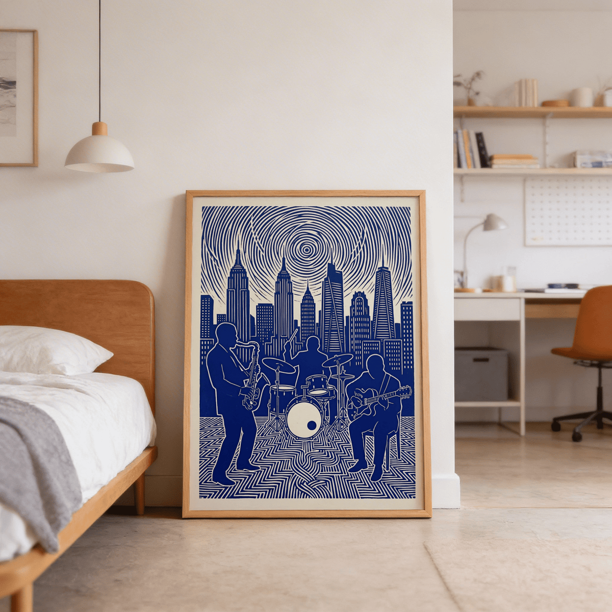 Print leaning on a floor of jazz band wall art in blue and beige with cityscape next to a bed