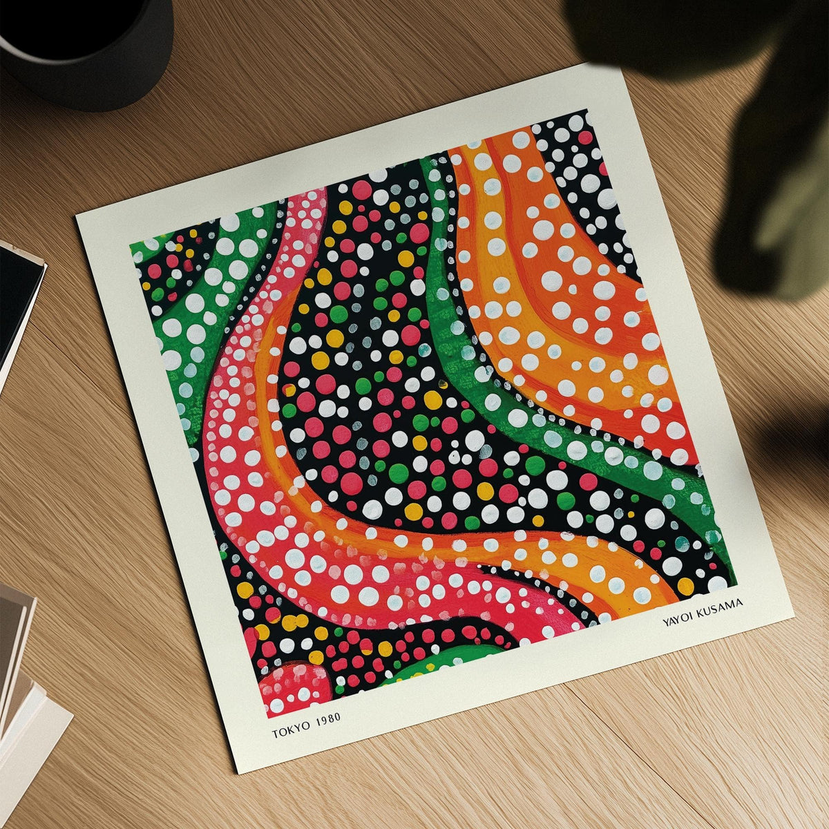 Abstract Colorful Art print with wavy lines and dots lying on a wooden surface with a plant shadow