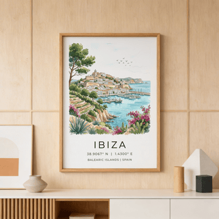 Ibiza Landscape Print of a coastal town in watercolour style above a cabinet with pottery
