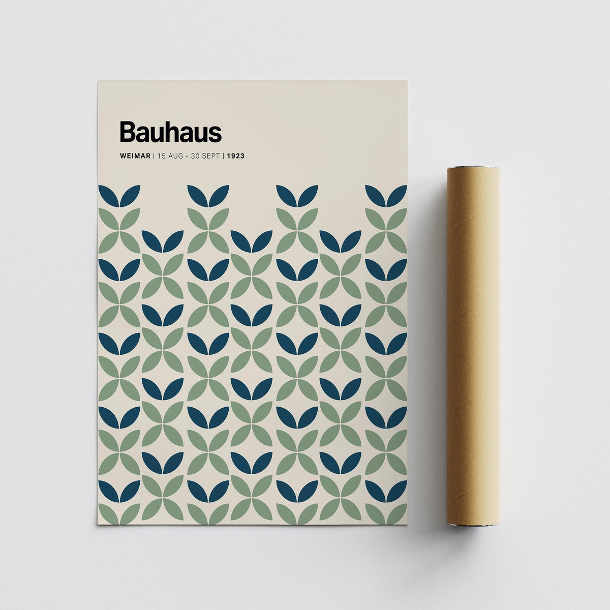 Blue and Green Wall Art close-up of geometric leaf pattern with packaging tube on a grey surface