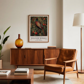 Pheasant wall art with red fruit and green leaves above a wooden sideboard in a sitting room