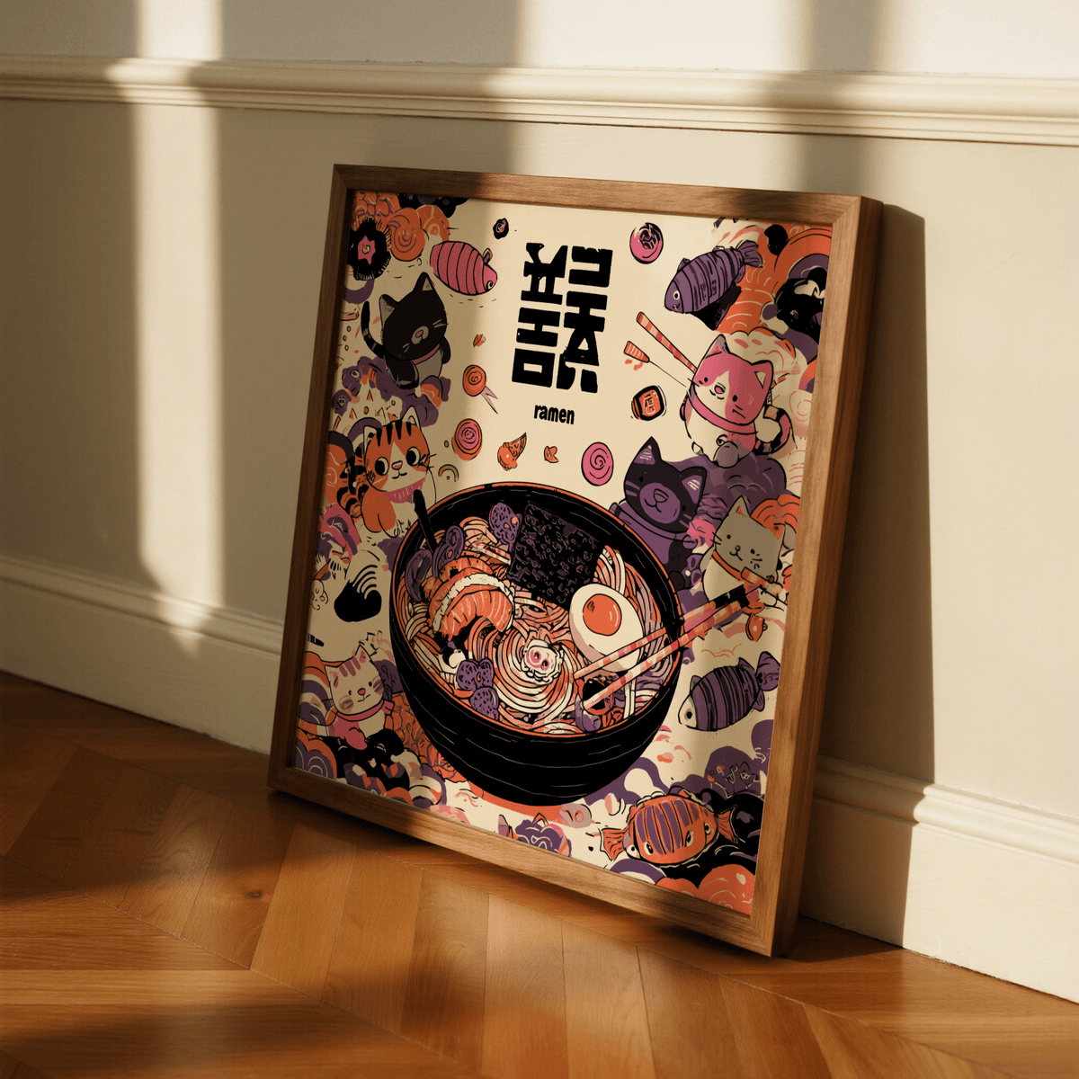 Framed Cat Ramen print with cute cartoon cats and ramen bowl leaning against a white wall on wooden floor