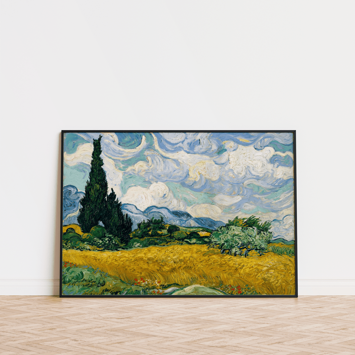 Cypress Tree Landscape print leaning on a wooden floor with swirling blue sky and yellow field