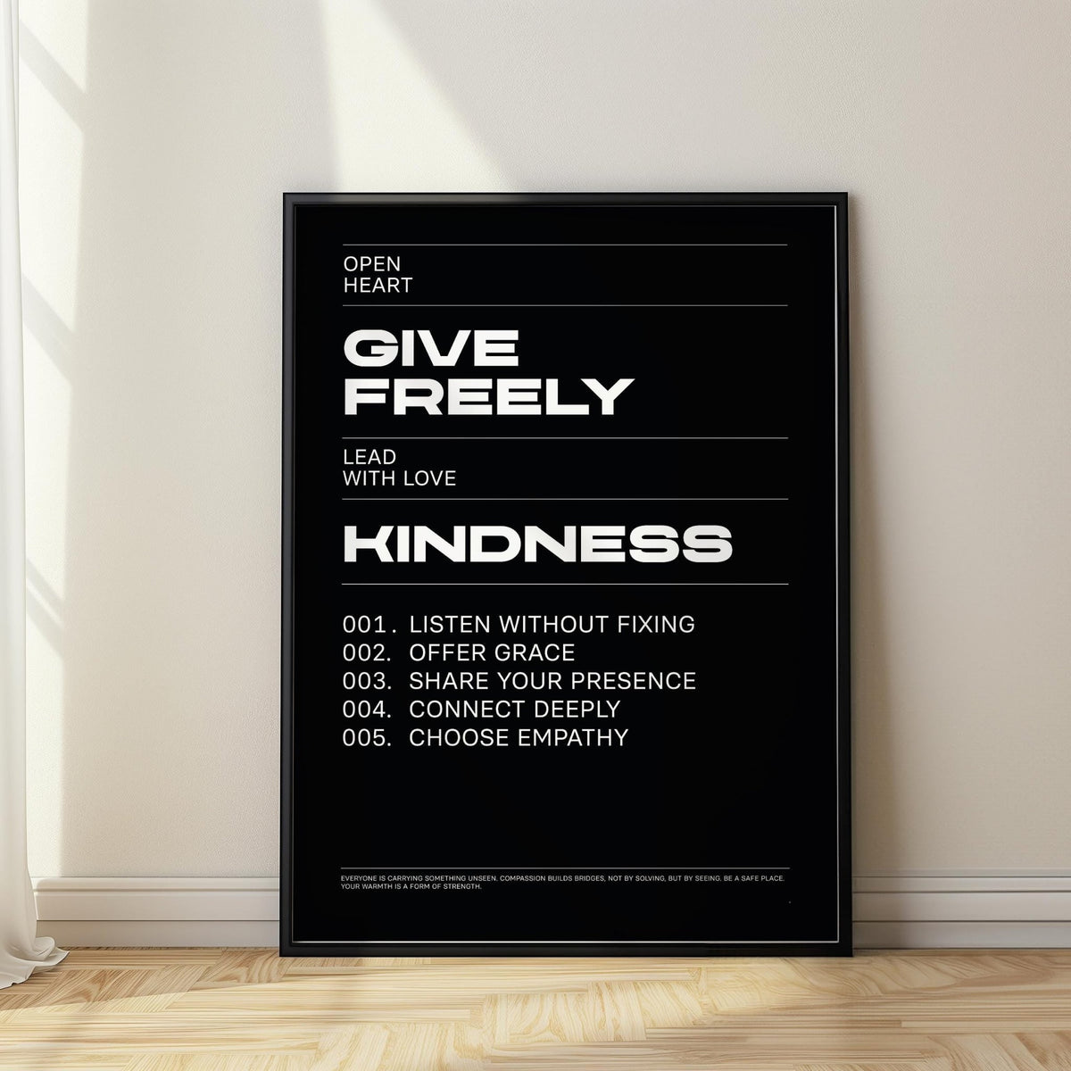 Art with Quote leaning on a wooden floor with minimalist black and white text and natural light