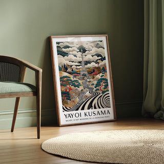 Print leaning on floor of surreal Eiffel Tower art with swirling black and white river and colourful trees next to chair