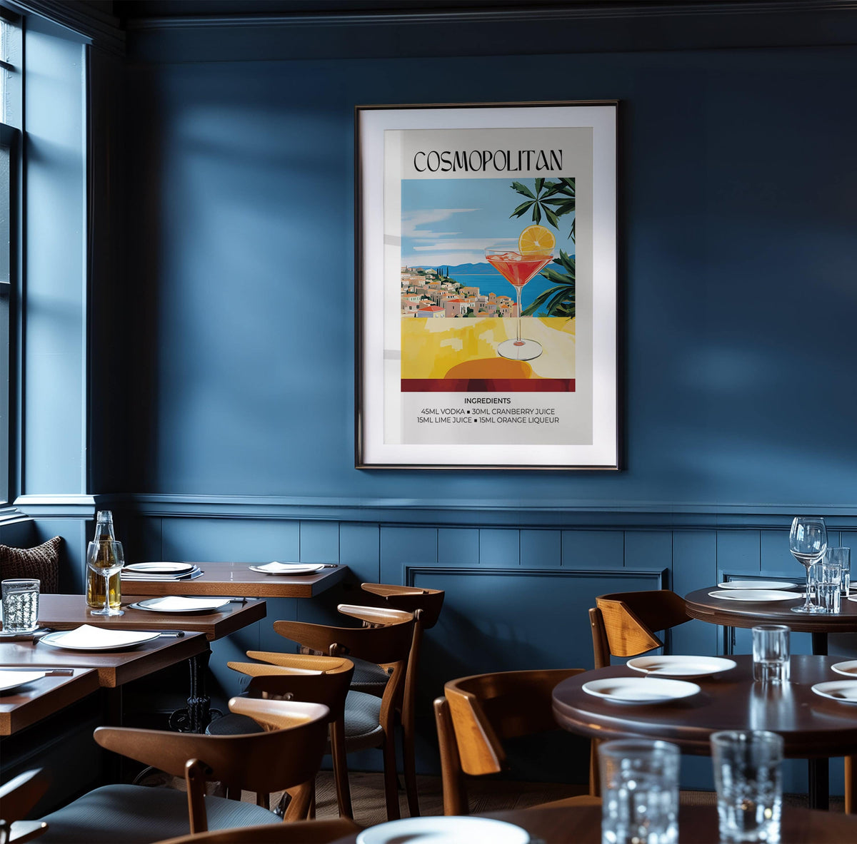 Framed Drink Art print of a cosmopolitan cocktail glass with blue sky and greenery in a dark blue dining room
