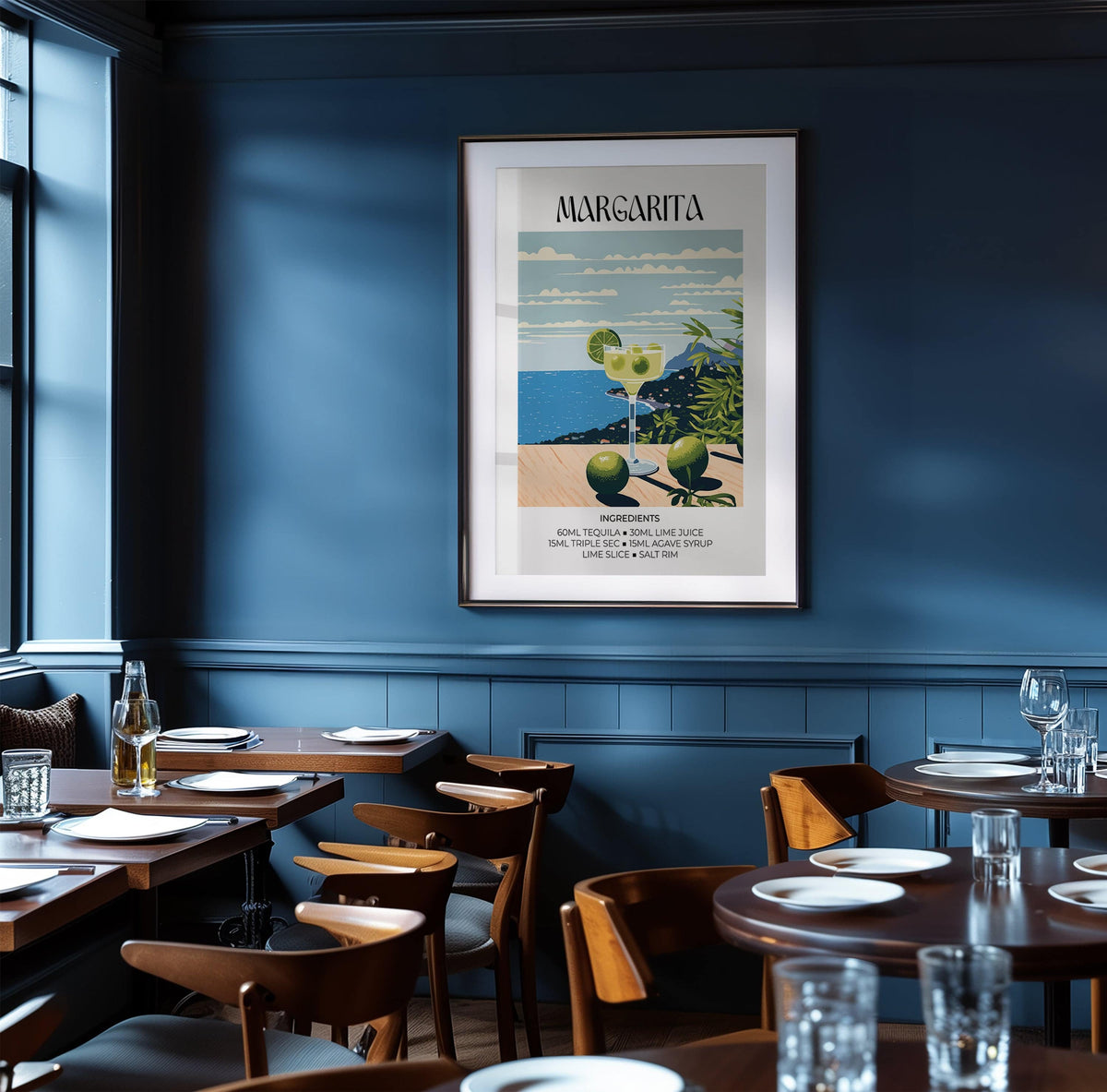 Framed Matisse Margarita Cocktail print illustrating a margarita glass with lime against a blue sea backdrop in a dark blue restaurant room