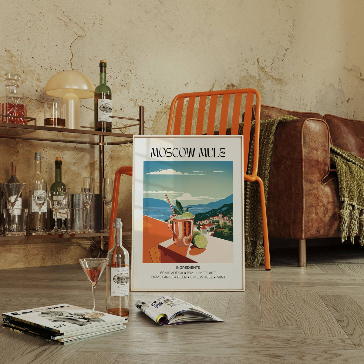 Drinks artwork print leaning on the floor with an orange chair and drinks trolley in the background