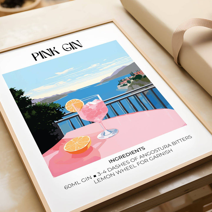 Bar Cart Art framed print close-up of pink gin cocktail with lemon and blue seaside background
