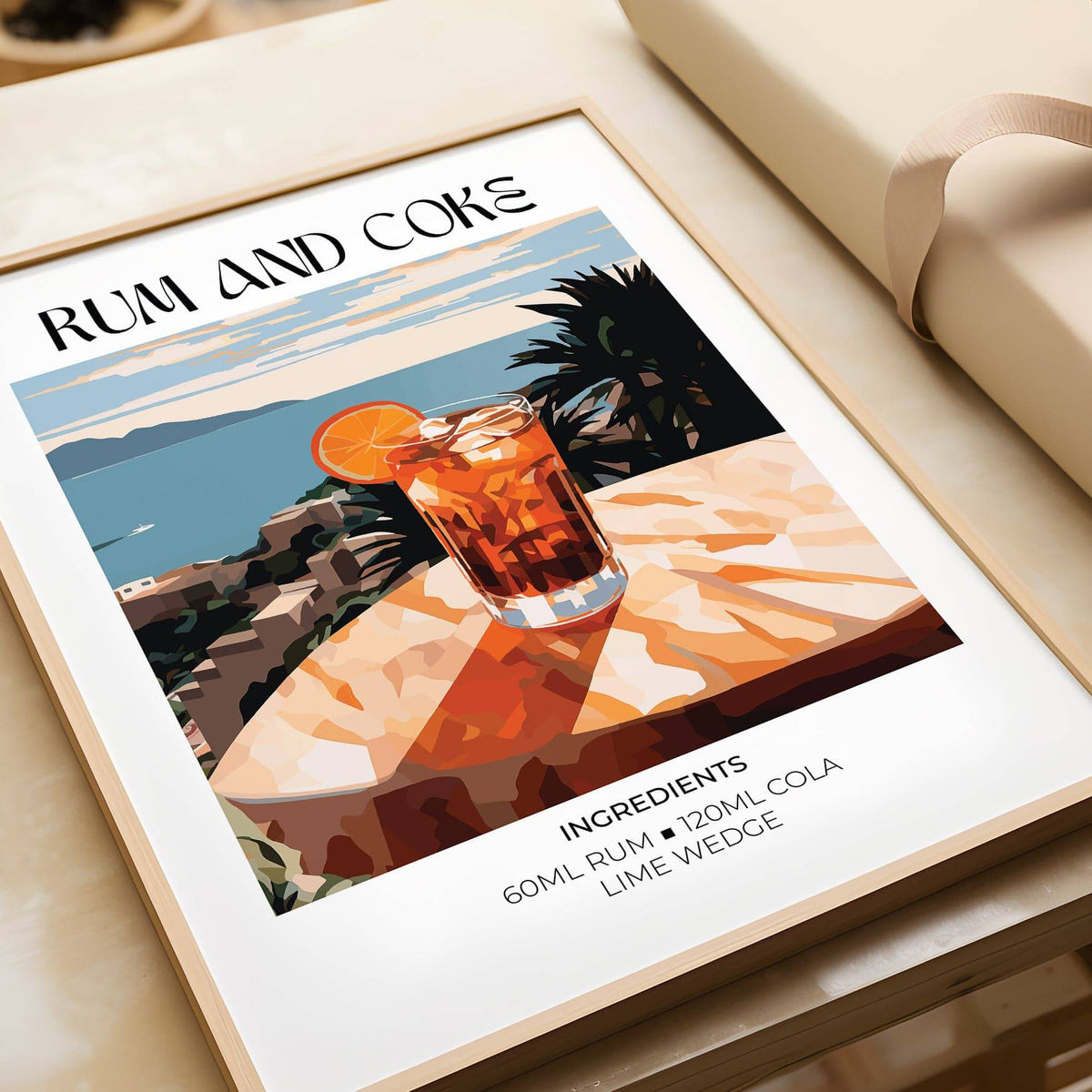 Cocktail recipe poster of rum and coke with an orange slice and coastal background shown close up on a table