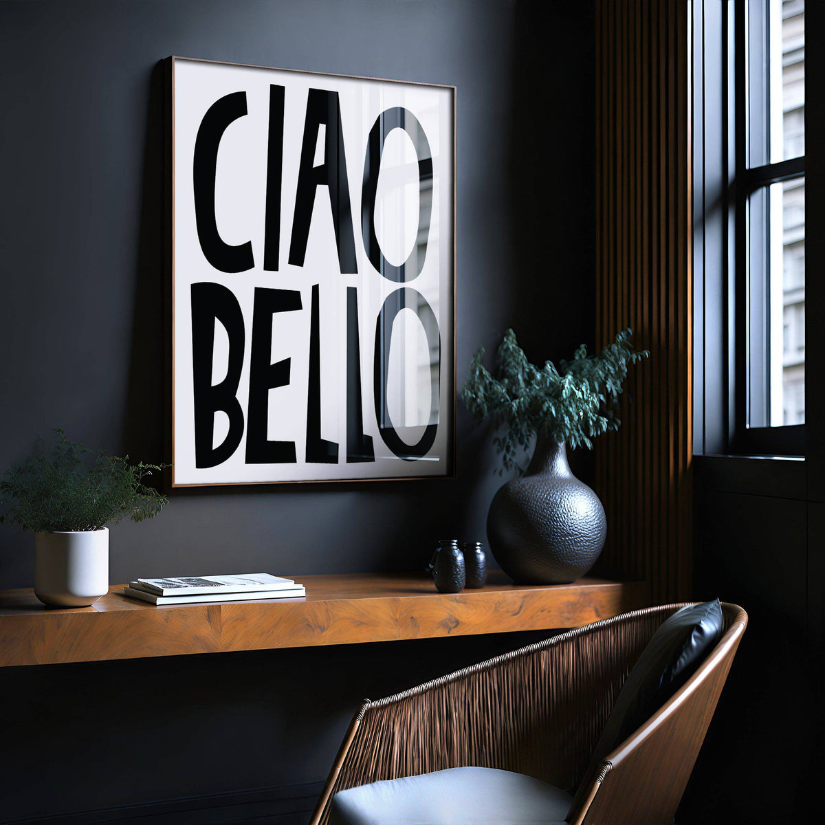 Italian wall art with ciao bello black text in a wooden frame above a wooden shelf with plants and books