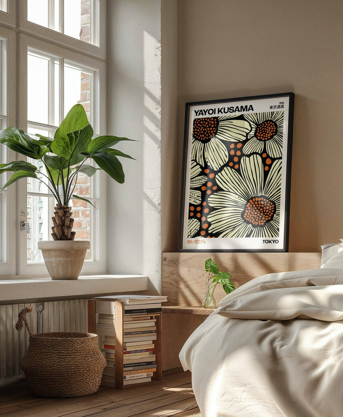 Modern Floral Art Print leaning on bedroom headboard with a green plant on window sill
