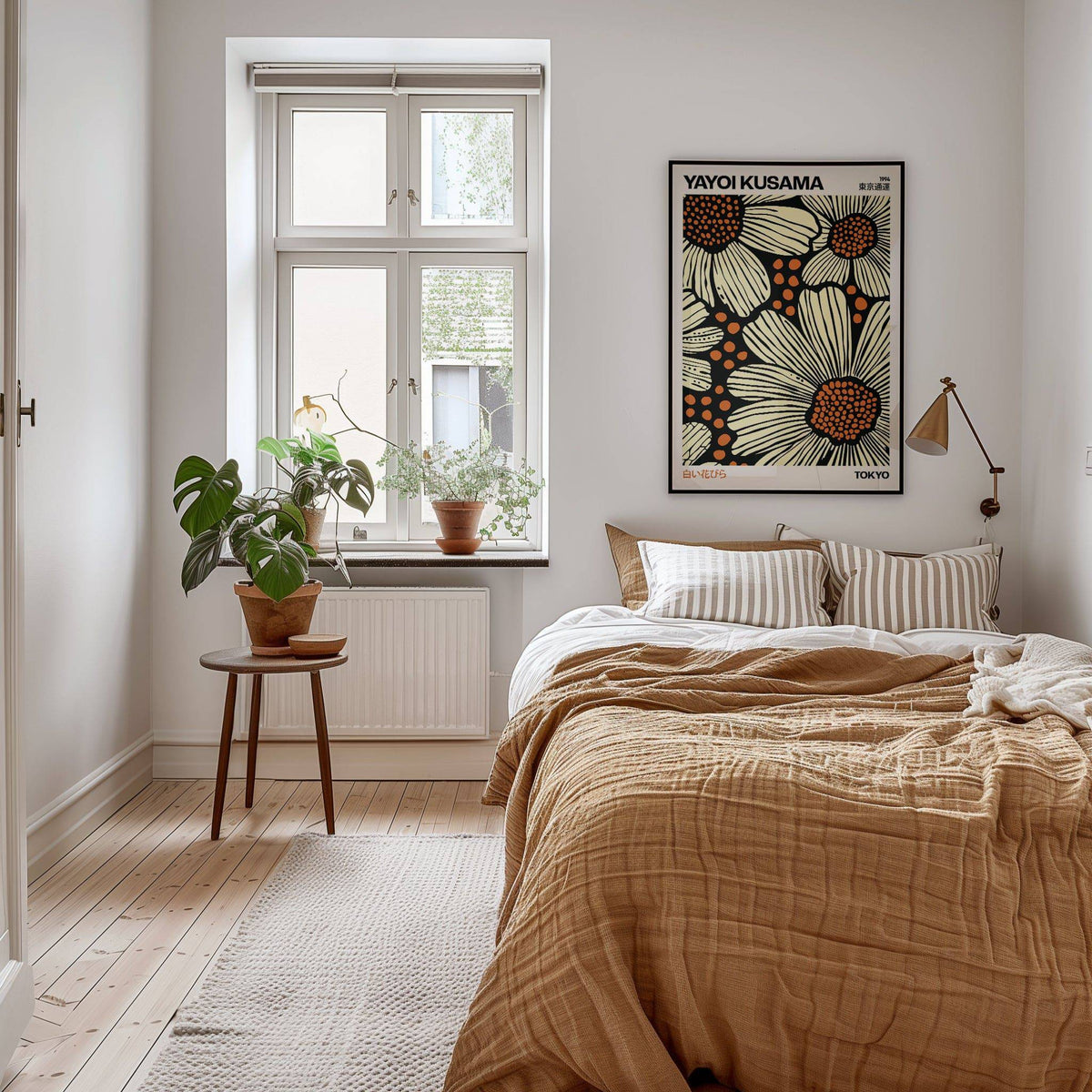 Modern Floral Art Print with large beige daisies and orange centres above a beige bed and wooden side table