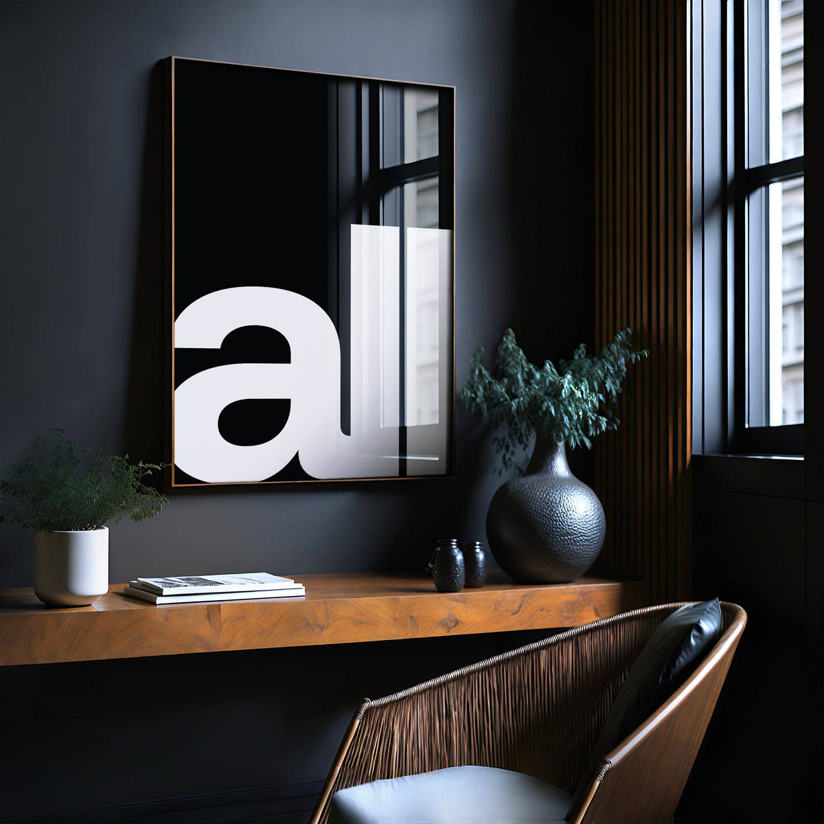 Typography Art Prints in a dark framed print with large white text on black above a wooden shelf with vases