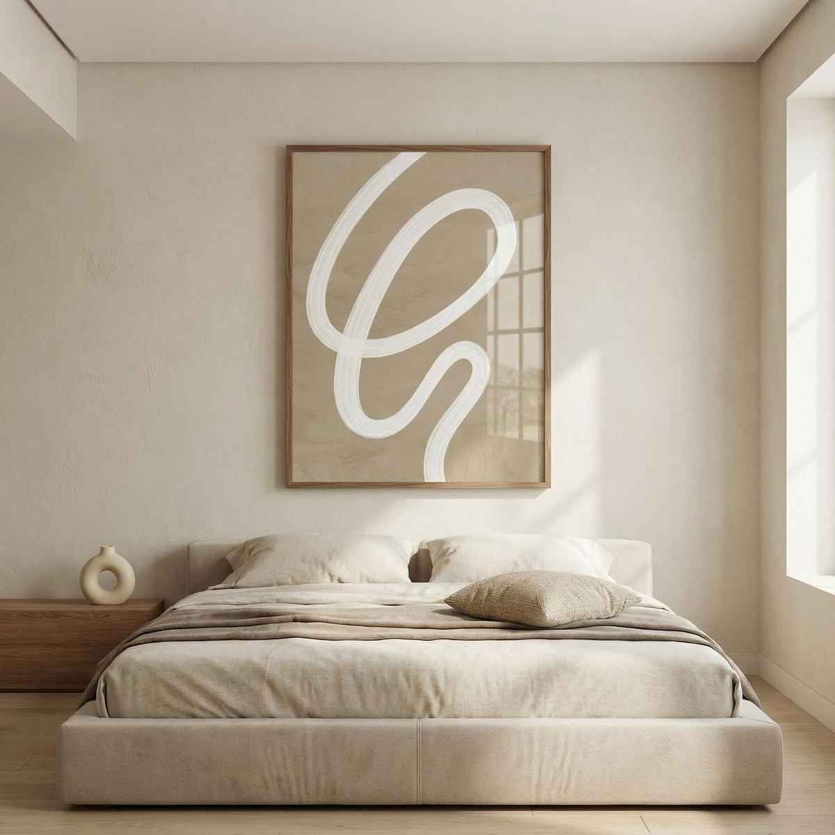 Abstract painting minimalist above a beige bed with neutral bedding and a circular vase on a wooden bedside table