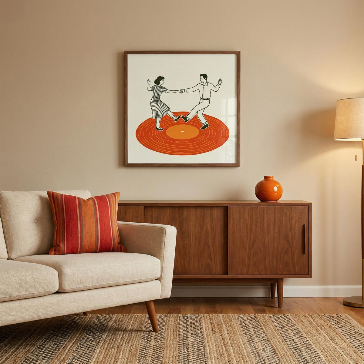 Vintage Dance Art Print framed on a wall with an orange vase on wooden sideboard in a living room