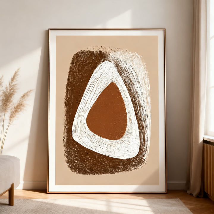 Print leaning on the floor of organic minimalist wall art with abstract earth tones and a neutral room