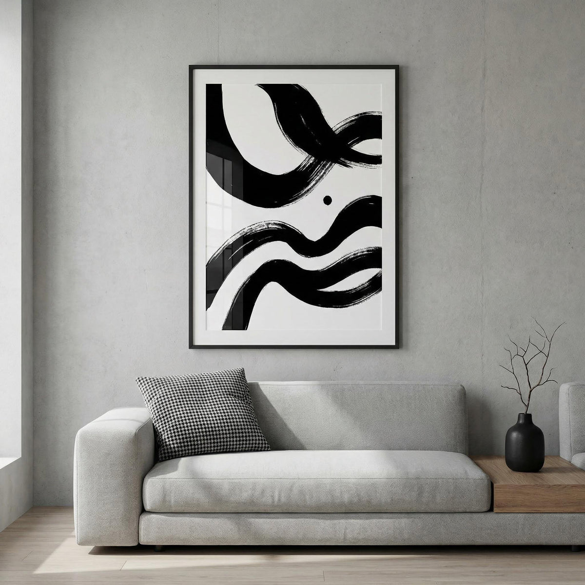 Black and white paintings abstract wall art with bold ink waves above a light grey sofa