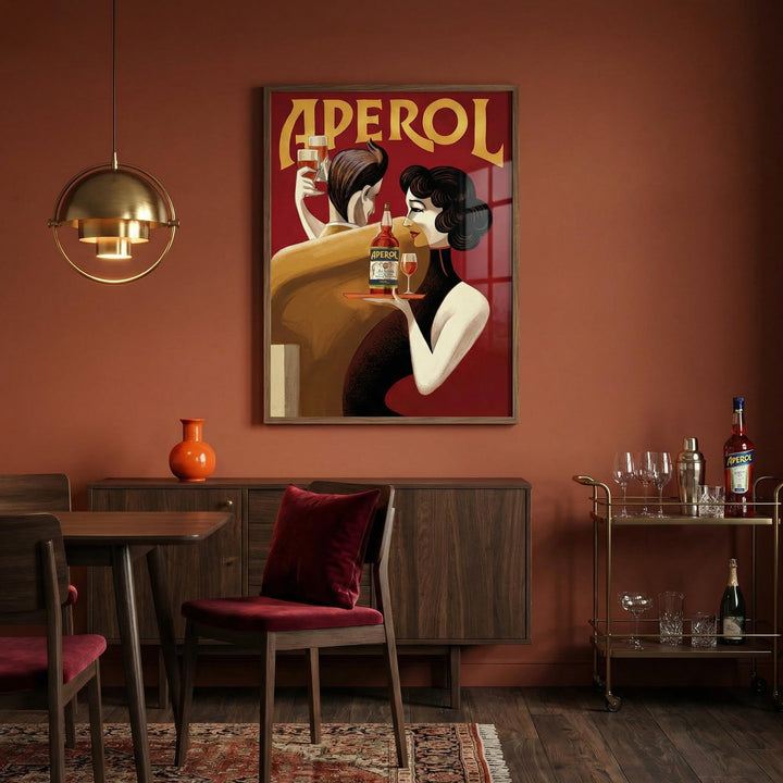 Dining room with Aperol poster on the wall, table, chairs, and bar cart.