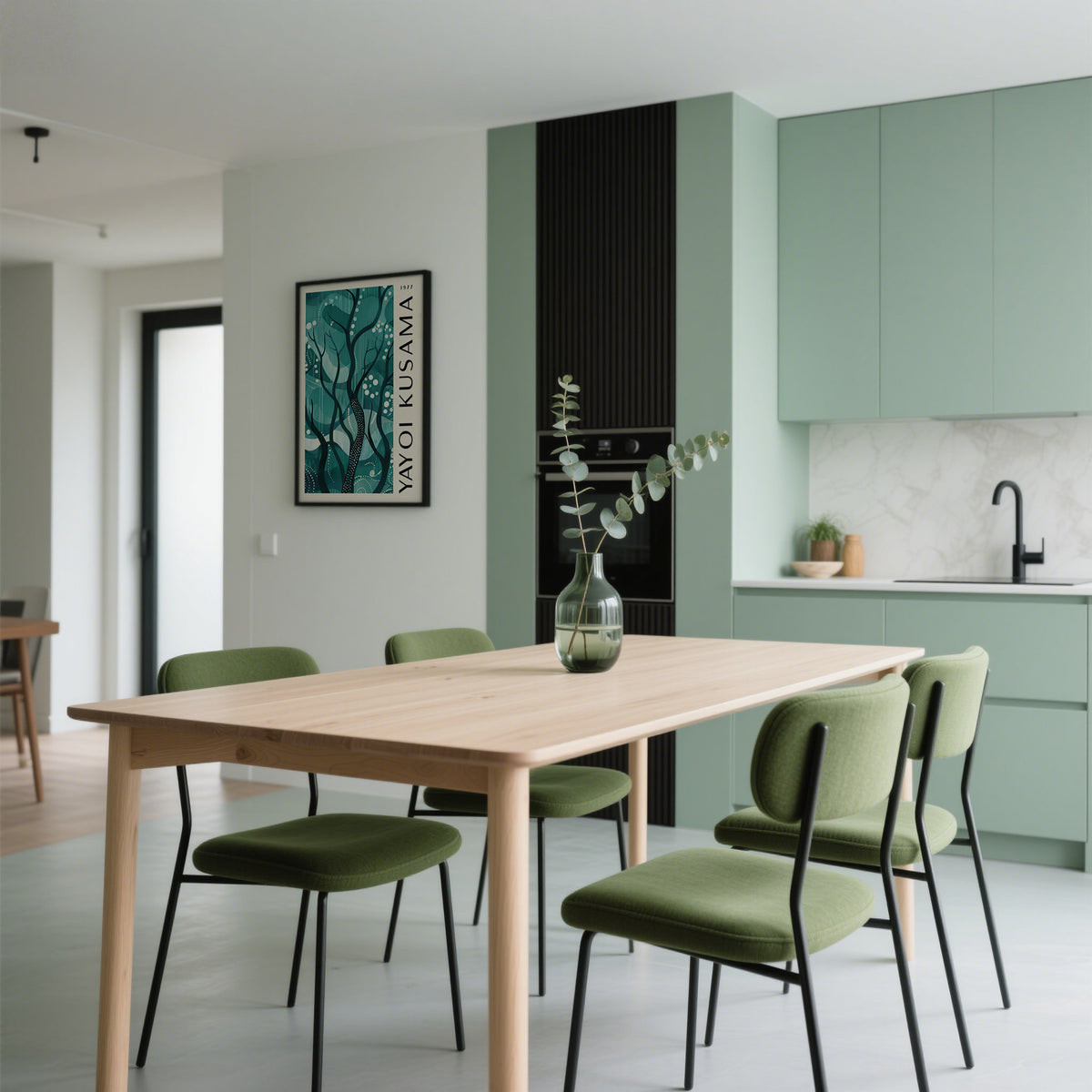 Green Nature Poster on a kitchen wall with green cabinetry and a dining table with green chairs
