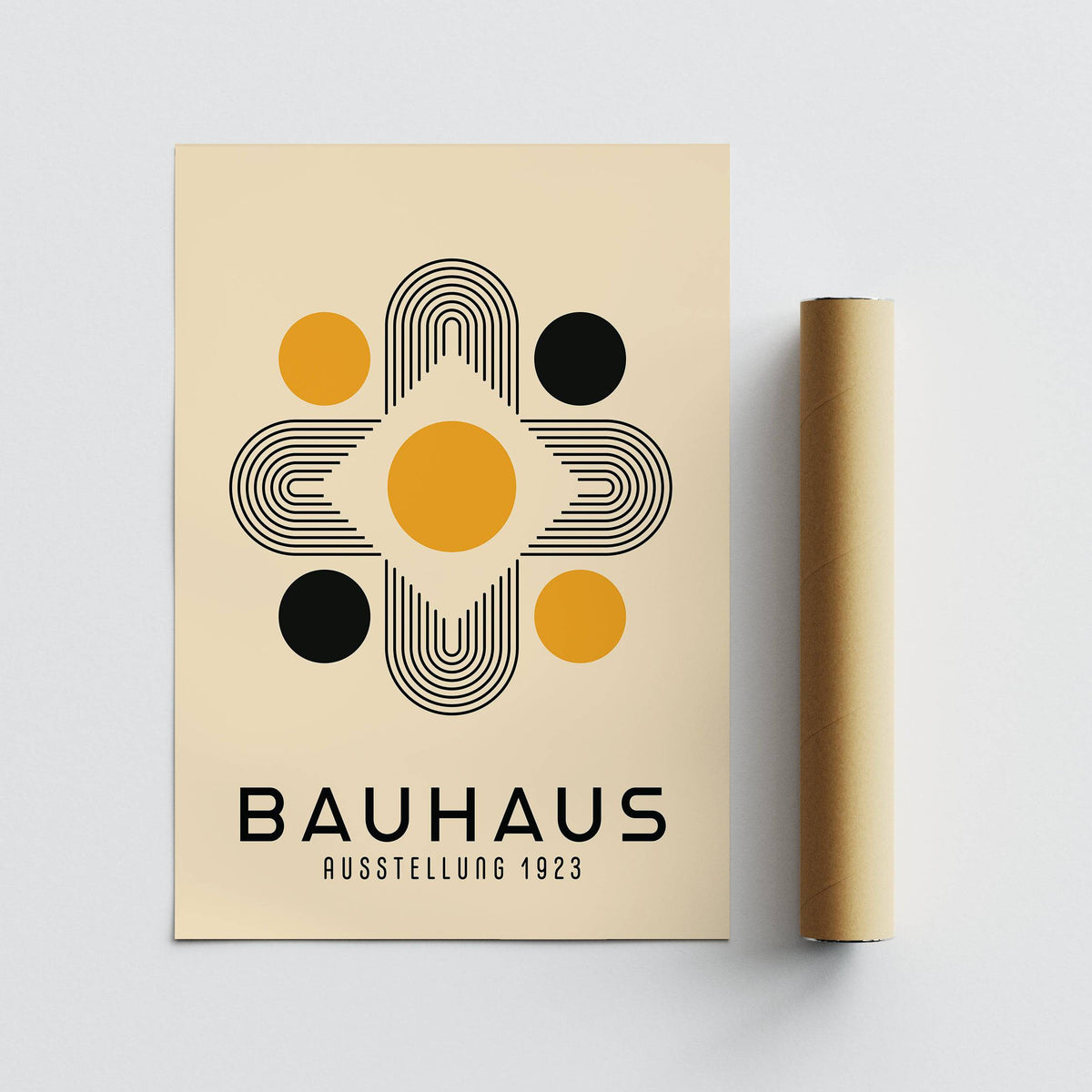 Geometric Abstract Wall Art of Bauhaus style shapes with black and gold circles and lines next to a packaging tube
