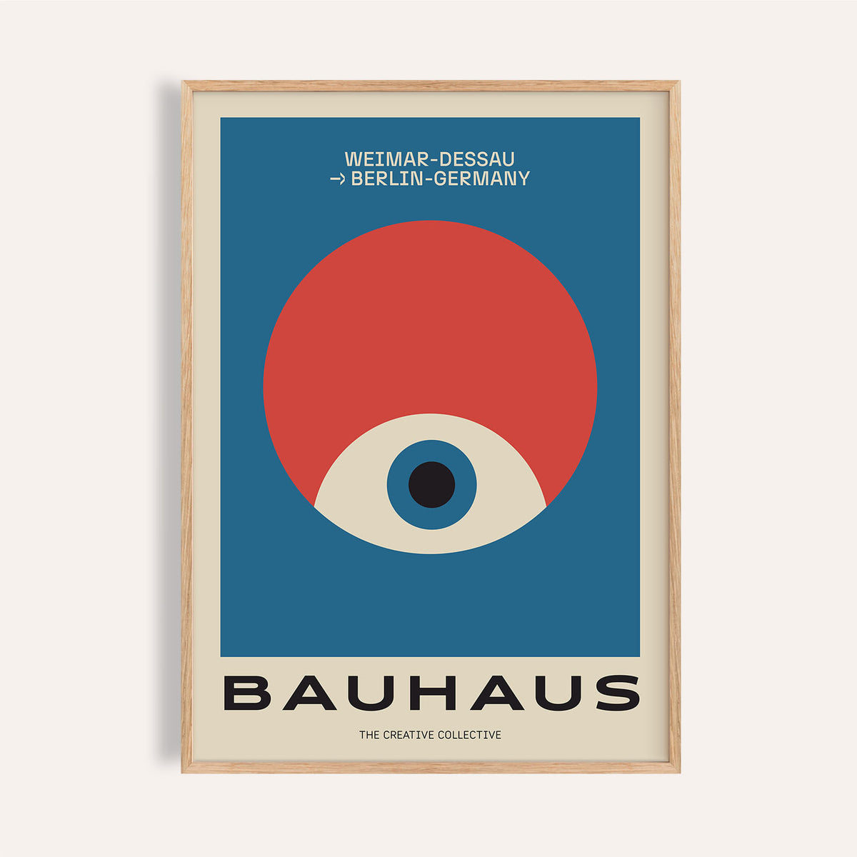 Framed print with modern geometric abstract art showing an eye shape in red and blue with black text
