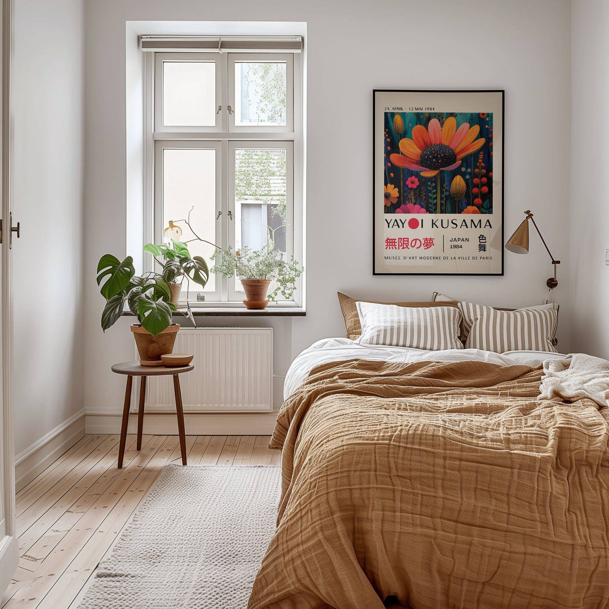 Flower wall decor of an orange flower with black centre in a neutral bedroom with plants on a stool