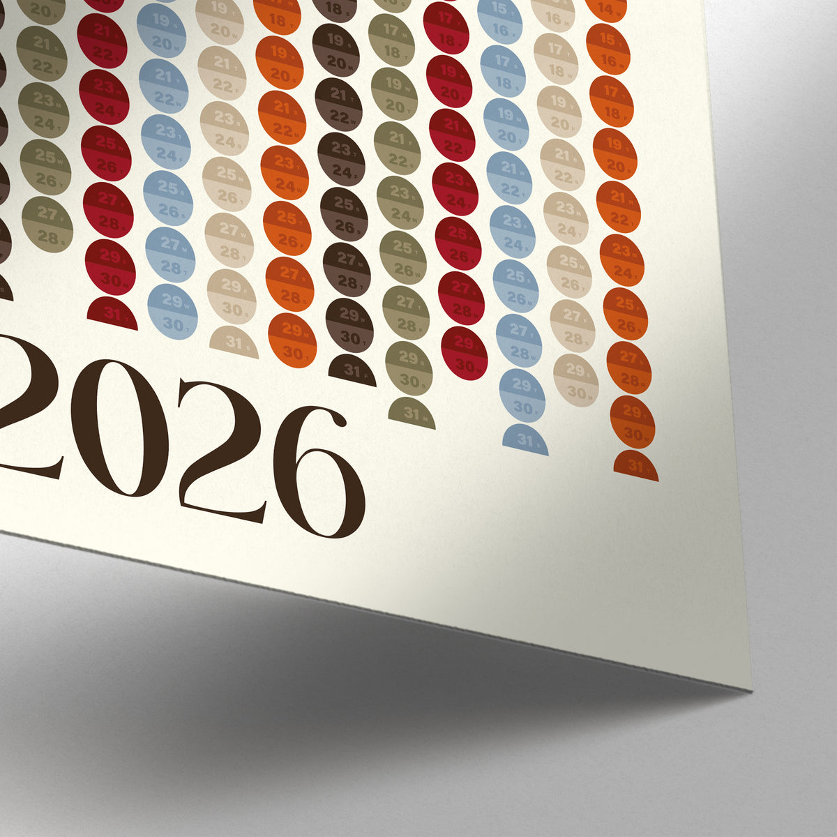 Close-up detail of Big Calendar for Wall showing colourful minimalist circles and 2026 typography on cream background