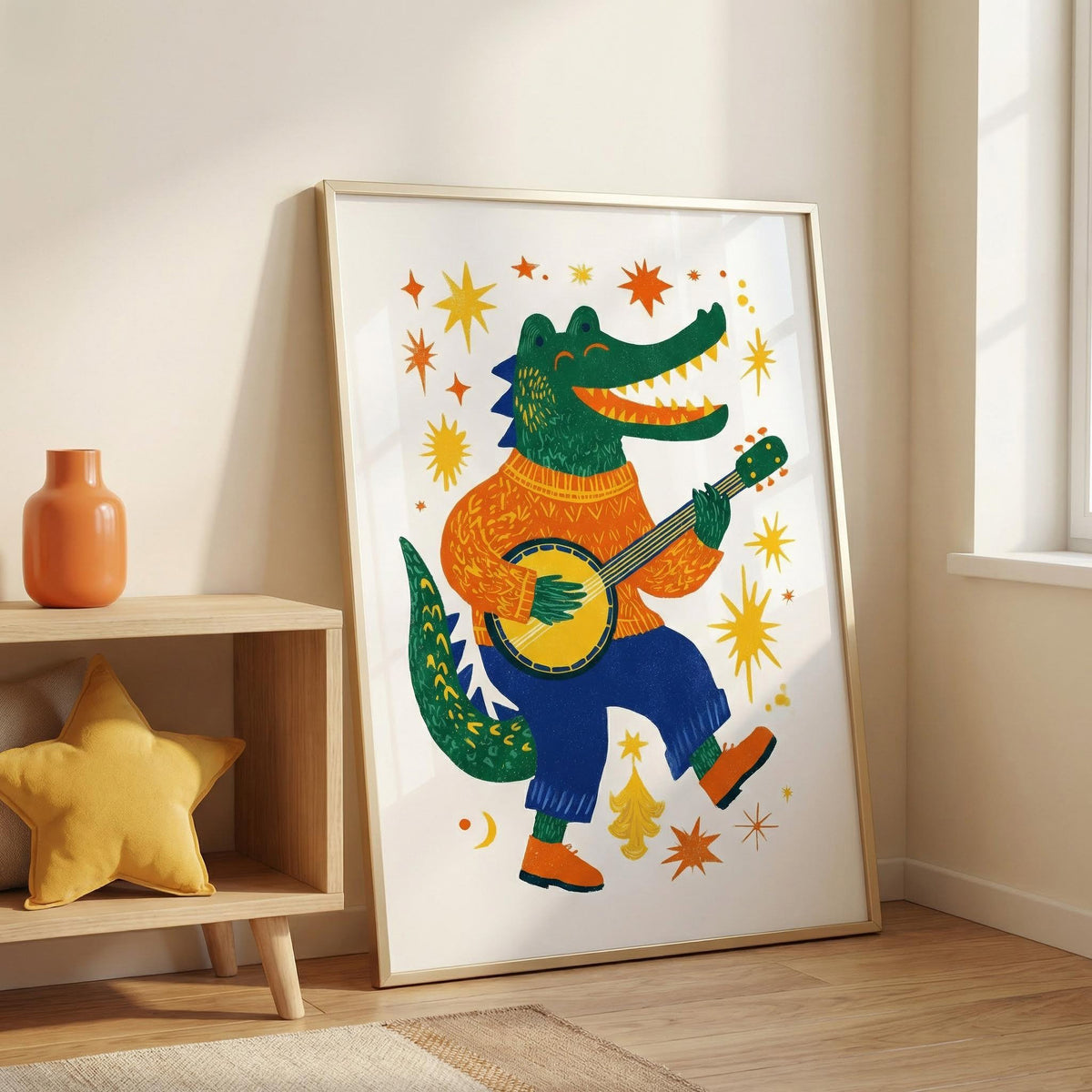 Funny Crocodile Art Print leaning on a floor next to a wooden shelf with a yellow star cushion