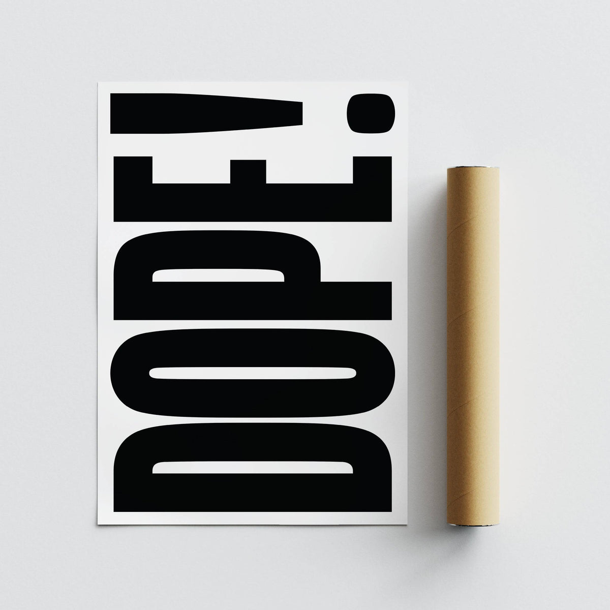 Detail close-up of a Big Text Poster with bold black dope typography text beside a brown packaging tube
