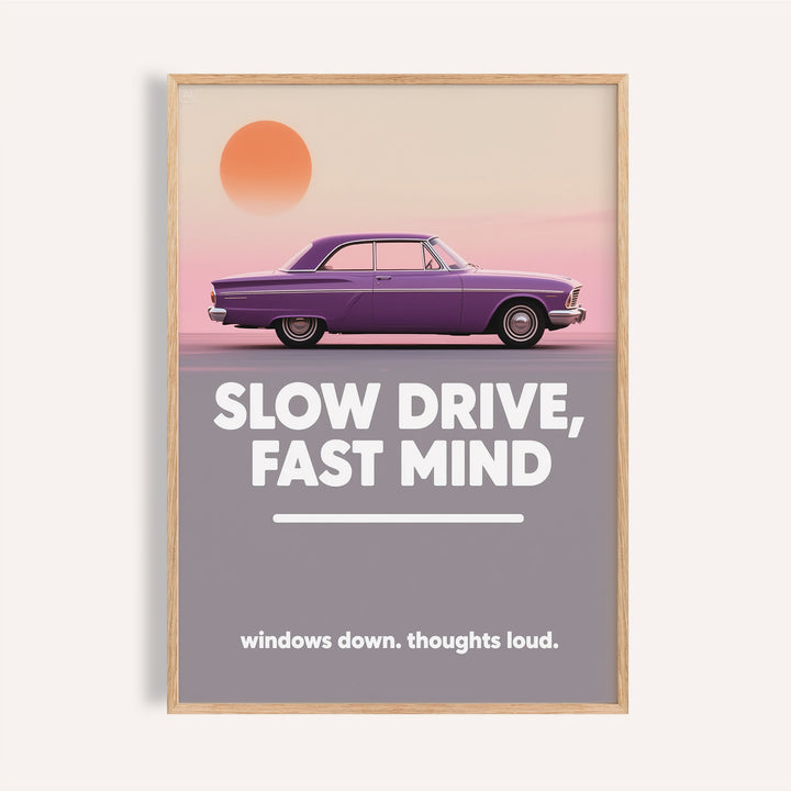 Framed vintage car wall art featuring a purple car and bold white typography