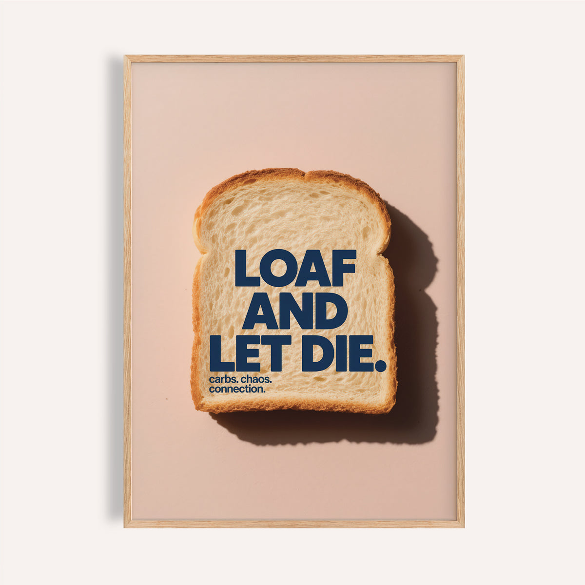 Framed print of a slice of white bread with dark blue typography on a pale pink background