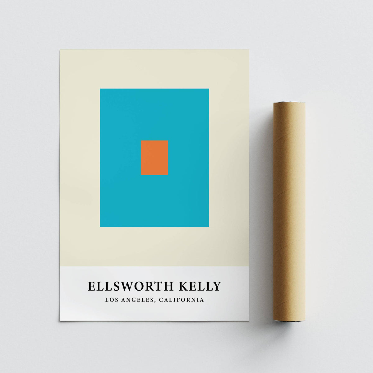 Wall Office Art with orange and blue squares with a rolled packaging tube on a grey surface