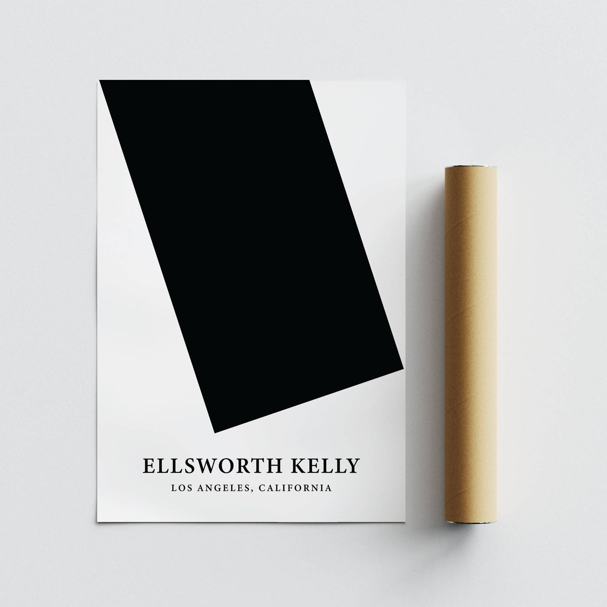 Black and White Office Wall Art lying flat with brown packaging tube beside it on a grey surface