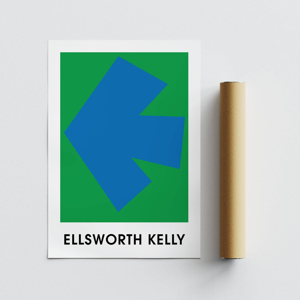 Print of blue arrow shape on green background beside a brown packaging tube