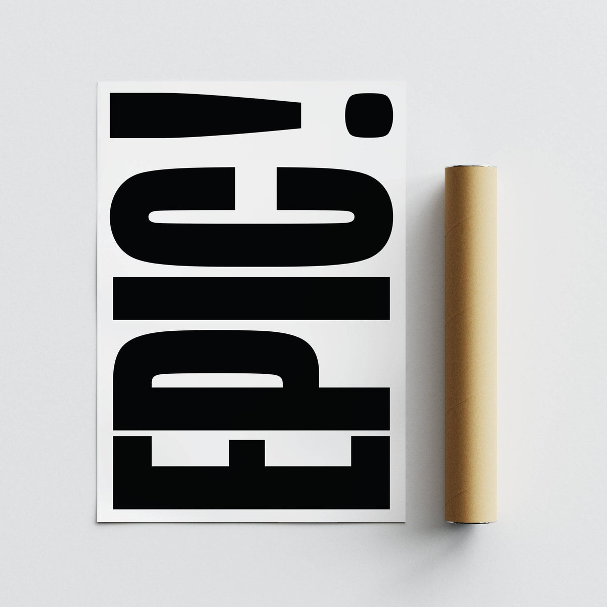 Detail close-up of EPIC typography wall art with black letters on white background and a brown packaging tube