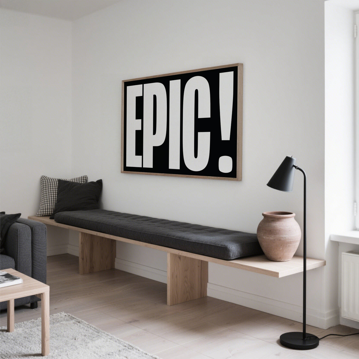 Posters Bold Font framed print with white text on black above a bench with cushions and a floor lamp